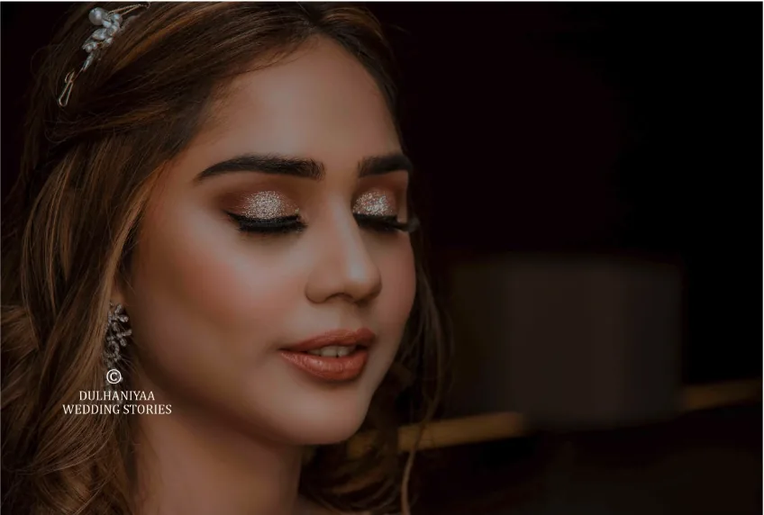 Bride with glittering eye makeup and a delicate hair accessory